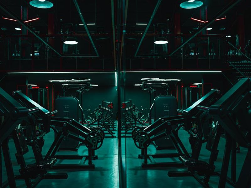 Atmospheric low light gym with carbon texture and neon lights